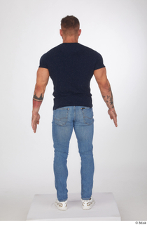 Garrott blue jeans blue t shirt casual dressed standing white…